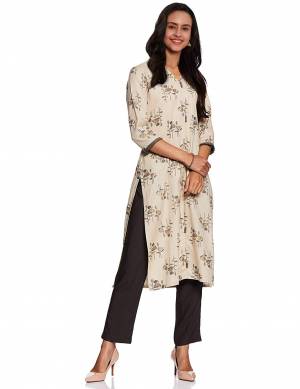 Here Is A Pretty Pair Of Readymade Kurti With Bottom In Cream And Black Color Respetively. This Printed Kurti Is Fabricated On Cotton Paired With Rayon Fabricated Plain Bottom. 