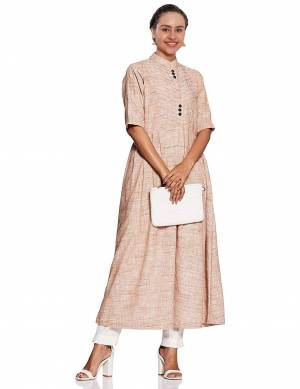 Another Beautiful Tunic Patterned Readymade Deisgner Kurti Is Here In Light Beige Color Fabricated On Cotton Flex. It Has Pretty Yoke Pattern With Buttons. Buy Now.