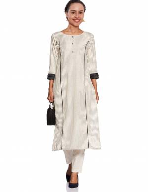 Beat The Heat This Summer With Cool Cotton Kurti With This Readymade Kurti In White Color Fabricated On Cotton. It Is Beautified With Lining Prints All Over. 