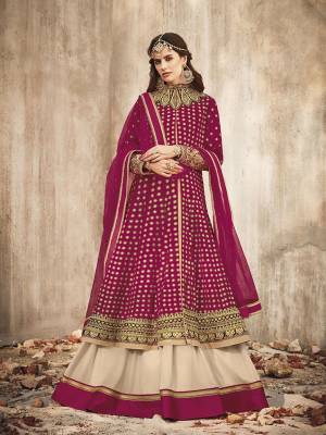 Grab This Beautiful Heavy Designer Anarkali Suit In Magenta Pink Color. Its Heavy Embroidered Top IS Fabricated On Velvet Paired With Santoon Bottom And Net Fabricated Dupatta. Buy This Semi-Stitched Suit Now.
