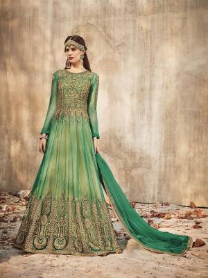 Flaunt Your Rich and Elegant Taste Wearing This Designer Anarkali Suit In Green Color. Its Heavy Embroidered Floor Length Top Is Fabricated on Net Paired With Santoon Bottom And Net Fabricated Dupatta. Buy Now.