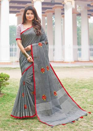 Flaunt Your Rich And Elegant Taste Wearing This Lovely Grey Color Paired With Baby Pink Colored Blouse. This Saree And Blouse Are Fabricated On Linen Cotton Which Gives A Rich Look To Your Personality. It Is Beautified With Embroidered Butti All Over The Saree