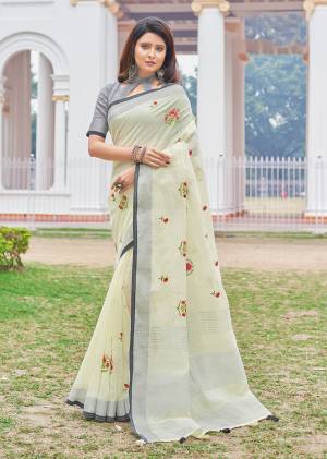 You Will Definitely Earn Lots Of Compliments Wearing This Designer?Saree In Pastel Yellow Color Paired With Grey Colored Blouse. This Saree And Blouse Are Fabricated On Rich Linen Cotton Fabric. This Pretty Saree Is Light Weight, Durable And Easy To Carry All Day Long