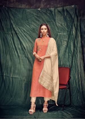 Celebrate This Festive Season With Beauty And Comfort Wearing This Readymade Kurti In Orange Color Paired With Cream Colored Dupatta. This Hand Work Kurti Is Banarasi Silk Based Paired With Viscose Silk Dupatta. 
