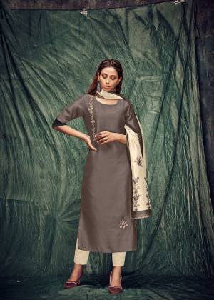 Rich And Elegant Looking Designer Readymade Pair Of Kurti And Dupatta In Sand Grey Color Paired With Cream Colored Dupatta. Its Top Is Art Silk Based Paired With Digital Pinted Silk Dupatta. It Is Light In Weight And Easy To Carry All Day Long. 