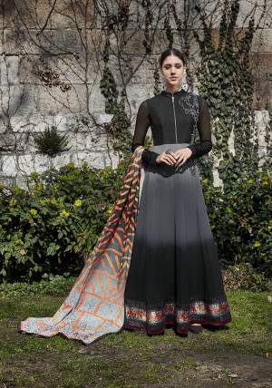 For A Bold And Beautiful Look, Grab This Designer Floor Length Suit In Black And Grey Color Paired With Black Colored Bottom And Grey Colored Dupatta. Its Top Is Fabricated On Georgette Paired With Santoon Bottom And Chiffon Fabricated Dupatta. 