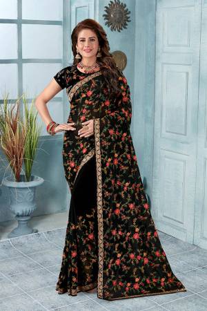 Here Is An Attractive Looking Heavy Designer Saree In Black Color Paired With Black Colored Blouse. This Saree And Blouse Are Fabricated On Georgette Beautified With Coloful Resham Embroidery With Jari & Stone Work, Buy Now.