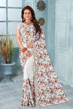 Here Is An Attractive Looking Heavy Designer Saree In White Color Paired With Black Colored Blouse. This Saree And Blouse Are Fabricated On Georgette Beautified With Coloful Resham Embroidery With Jari & Stone Work, Buy Now.