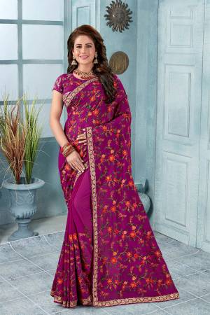 Here Is An Attractive Looking Heavy Designer Saree In Magenta Pink Color Paired With Black Colored Blouse. This Saree And Blouse Are Fabricated On Georgette Beautified With Coloful Resham Embroidery With Jari & Stone Work, Buy Now.
