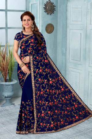Here Is An Attractive Looking Heavy Designer Saree In Navy Blue Color Paired With Black Colored Blouse. This Saree And Blouse Are Fabricated On Georgette Beautified With Coloful Resham Embroidery With Jari & Stone Work, Buy Now.