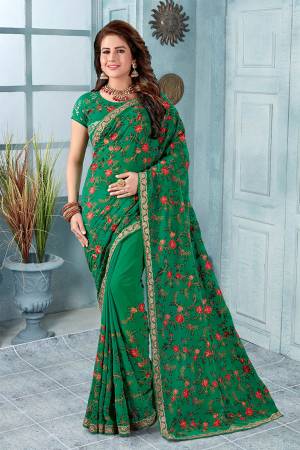 Here Is An Attractive Looking Heavy Designer Saree In Green Color Paired With Black Colored Blouse. This Saree And Blouse Are Fabricated On Georgette Beautified With Coloful Resham Embroidery With Jari & Stone Work, Buy Now.