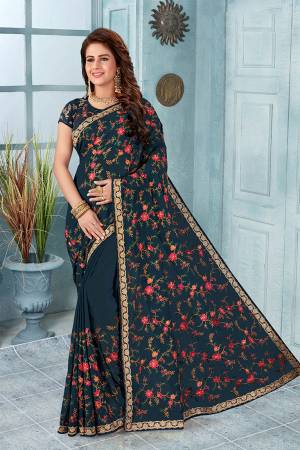 Here Is An Attractive Looking Heavy Designer Saree In Teal Blue Color Paired With Black Colored Blouse. This Saree And Blouse Are Fabricated On Georgette Beautified With Coloful Resham Embroidery With Jari & Stone Work, Buy Now.