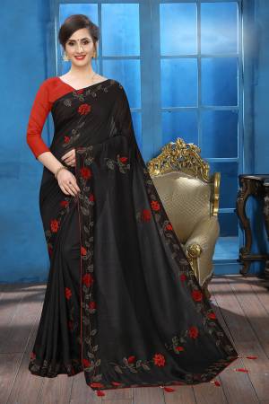 Grab This Pretty Attractive Looking Designer Saree In Black Color Paired With Red Colored Blouse. This Saree Is Fabricated On Soft Silk Paired With Art Silk Fabricated Blouse. It Is Beautified With Velvet Patch Work And Stone Work. Buy Now.