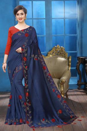 Grab This Pretty Attractive Looking Designer Saree In Navy Blue Color Paired With Red Colored Blouse. This Saree Is Fabricated On Soft Silk Paired With Art Silk Fabricated Blouse. It Is Beautified With Velvet Patch Work And Stone Work. Buy Now.