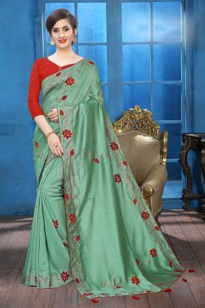 Grab This Pretty Attractive Looking Designer Saree In Sea Green Color Paired With Red Colored Blouse. This Saree Is Fabricated On Soft Silk Paired With Art Silk Fabricated Blouse. It Is Beautified With Velvet Patch Work And Stone Work. Buy Now.