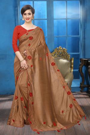Flaunt Your Rich And Elegant Taste Wearing This Lovely Designer Saree In Brown Color Paired With Red Colored Blouse. This Saree And Blouse Are Silk Based Beautified With Velvet Rose Patch Work And Attractive Stone Work. Buy This Rich and Elegant Looking Saree For The Upcoming Festive And Wedding Season.