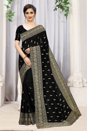 Add This Attractive Looking Designer Saree To Your Wardrobe For Upcoming Wedding And Festive Season. This Beautiful Saree Is In Black Color Fabricated On Art Silk. It Is Beautified With Heavy Jari Embroidery And Stone Work. 