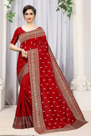 Add This Attractive Looking Designer Saree To Your Wardrobe For Upcoming Wedding And Festive Season. This Beautiful Saree Is In Red Color Fabricated On Art Silk. It Is Beautified With Heavy Jari Embroidery And Stone Work. 