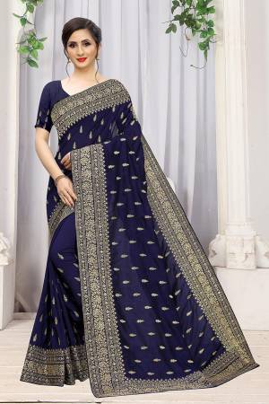 Add This Attractive Looking Designer Saree To Your Wardrobe For Upcoming Wedding And Festive Season. This Beautiful Saree Is In Navy Blue Color Fabricated On Art Silk. It Is Beautified With Heavy Jari Embroidery And Stone Work. 