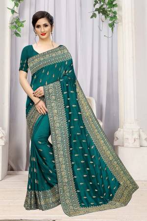 Add This Attractive Looking Designer Saree To Your Wardrobe For Upcoming Wedding And Festive Season. This Beautiful Saree Is In Turquoise Blue Color Fabricated On Art Silk. It Is Beautified With Heavy Jari Embroidery And Stone Work. 