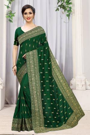 Add This Attractive Looking Designer Saree To Your Wardrobe For Upcoming Wedding And Festive Season. This Beautiful Saree Is In Green Color Fabricated On Art Silk. It Is Beautified With Heavy Jari Embroidery And Stone Work. 
