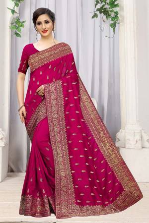 Add This Attractive Looking Designer Saree To Your Wardrobe For Upcoming Wedding And Festive Season. This Beautiful Saree Is In Rani Pink Color Fabricated On Art Silk. It Is Beautified With Heavy Jari Embroidery And Stone Work. 