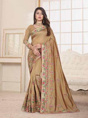 Here Is An Attractive Looking Heavy Designer Saree In Beige Color Paired With Beige Colored Blouse. This Saree And Blouse Are Fabricated On Art Silk Beautified With Coloful Resham Embroidery With Jari & Coding Work, Buy Now.