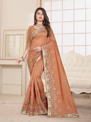 Here Is An Attractive Looking Heavy Designer Saree In Dark Beige Color Paired With Dark Beige Colored Blouse. This Saree And Blouse Are Fabricated On Art Silk Beautified With Coloful Resham Embroidery With Jari & Coding Work, Buy Now.