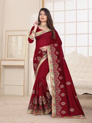 Here Is An Attractive Looking Heavy Designer Saree In Maroon Color Paired With Maroon Colored Blouse. This Saree And Blouse Are Fabricated On Art Silk Beautified With Coloful Resham Embroidery With Jari & Coding Work, Buy Now.