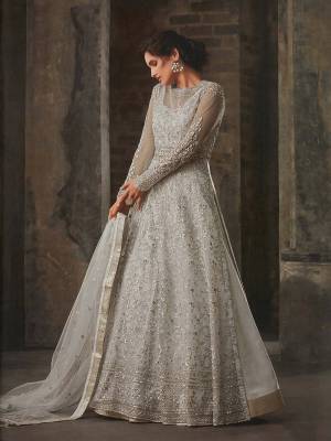 Get Ready For The Upcoming Festive And Wedding Season And Wear This Designer Indo-Western Light Grey Colored Suit As per Your Convinience As It Comes With Two Bottoms. Its Top Is Fabricated On Net Paired With Art Silk Fabricated Lehenga With Santoon Fabricated Another Bottom And Net Dupatta. Buy This Pretty Piece Now.
