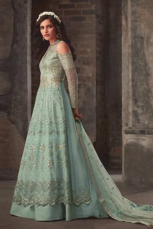 Look Pretty Wearing This Designer Indo-Western Suit All Over Aqua Blue Color. This Lovely Suit Comes With Two Bottoms. Its Top Is Fabricated On Net With Heavy Detailed Embroidery Paired With Art Silk Lehenga , Santoon Bottom And Net Fabricate Dupatta. Its Lovely Color And Detailed Embroidery Will Earn You Lots Of Compliments From Onlookers. 