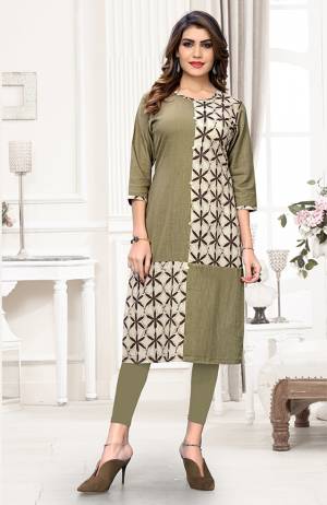 For Your Casual Wear, Grab This Readymade Straight Kurti In Olive Green Color Fabricated On Cotton Beautified With Prints. It Is Light Weight And Available In All Regular Sizes. 