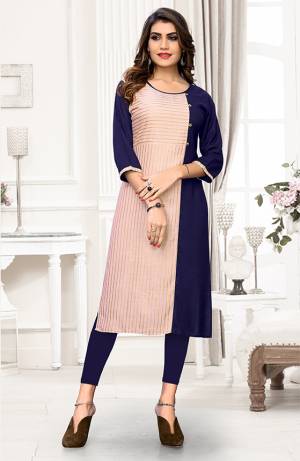 Look Pretty In This Simple And Elegant Readymade Kurti In Baby Pink And Navy Blue Color. It Is Fabricated On Rayon Which Is Soft Towards Skin And Easy To carry All Day Long. 