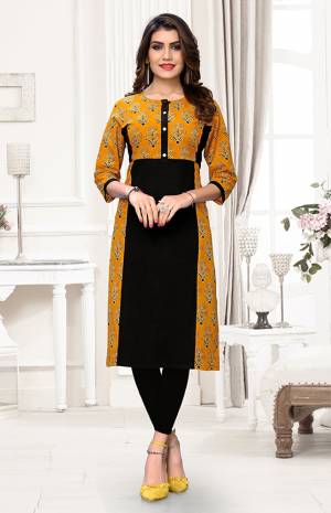 Here Is A Pretty Readymade Kurti For Your Casual Wear In Black & Musturd Yellow Color. It Is Fabricated On Cotton Beautified With Prints. You can Pair This Up With Same Or Contrasting Colored Attire. Buy Now.