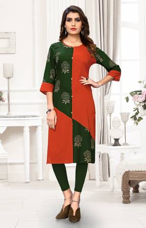 For Your Casual Wear, Grab This Readymade Straight Kurti In Dark Green And Rust Orange Color Fabricated On Cotton Beautified With Prints. It Is Light Weight And Available In All Regular Sizes. 