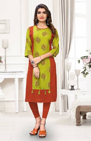 Look Pretty In This Simple And Elegant Readymade Kurti In Green And Rust Orange Color. It Is Fabricated On Cotton Which Is Soft Towards Skin And Easy To carry All Day Long. 