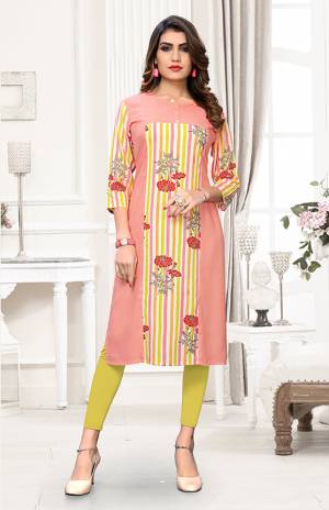 Add Some Casuals With This Simple Readymade Kurti In Baby Pink And Multi Color. This Lining Printed Kurti Is Fabricated On Rayon and Available In All Regular Sizes. 