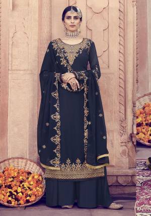 Catch All The Limelight Wearing This Heavy Designer Suit In All Over In Navy Blue Color. Its Heavy Embroidered Top And Dupatta Are Fabricated On Georgette Paired With Santoon Fabricated Bottom. It Is Beautified With Detailed Jari And Resham Embroidery With Stone Work. 
