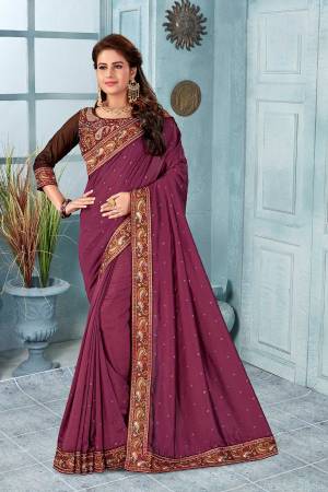Here Is A Very Pretty Kashmiri Embroidered Designer Saree In Magenta Pink Color. This Pretty Saree And Blouse Are Silk Based With Heavy Embroidered Multi Colored Thread Embroidery With Stone Work.