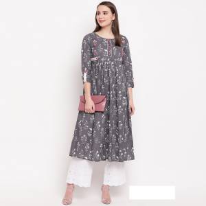 Here Is A Designer Readymade A-Line Patterned Kurti In Grey Color. It Is Fabricated On Cotton Beautified With Prints And Hand Work. It Is Light In Weight And Can Be Paired With Same Of Contrasting Colored Bottom. 