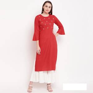 Celebrate This Festive Season With Beauty And Comfort Wearing This Designer Readymade Straight Kurti In Red Color Fabricated On Rayon. It Is Beautified With Elegant Hand Work Which Will Earn You Lots Of Compliments From Onlookers. Pair It Up With A White Colored Bottom And Dupatta To Complete The Look. 
