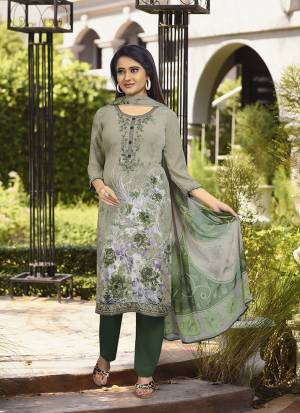 For Your Semi-Casuals, Grab This Pretty Straight Suit In Shades Of Green. Its Top And Bottom Are Fabricated On Crepe Paired With Georgette Fabricated Dupatta. Buy This Dress Material Now