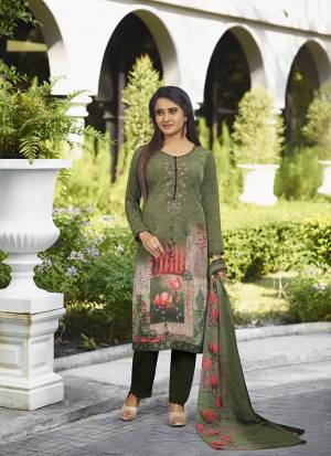 Enhance Your Personality In This Rich And Elegant Looking Printed Suit In Shades Of Green. This Dress Material Is Fabricated On Crepe Paired With Georgette Fabricated Dupatta. Buy Now