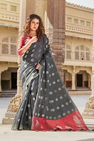 Celebrate This Festive Season With Beauty And Comfort Wearing This Elegant Looking Saree In Grey Color Paired With Pink Colored Blouse. This Saree And Blouse Are Fabricated On Linen Cotton Beautified With Weave. Buy Now.