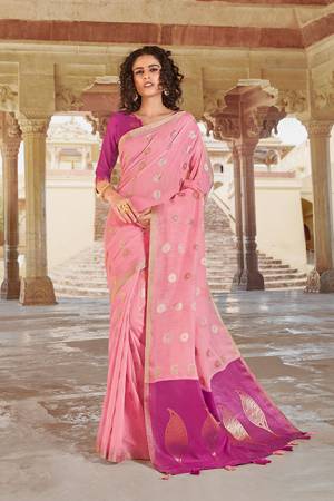 Rich and Elegant Looking Saree Is Here In Light Pink Color Paired With Magenta Pink Colored Blouse. This Saree And Blouse are Linen Cotton Based Beautified With Minimal Weave. 