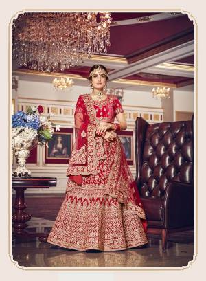 Get Ready For Your D-Day With This Heavy Designer Lehenga Choli In Dark Pink Color. This Heavy Embroidered Lehenga Choli Is Fabricated On Velvet Paired With Net Fabricated Dupatta. It Is Beautified With Heavy Jari Embroidery And Stone Work. Buy This Bridal Lehenga Now