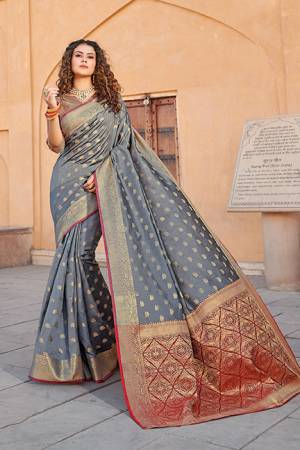 Classy Saree look pretty like never before.Wearing this Grey Color Saree which made from Handloom Silk With Maroon & Golden Color Handloom Silk blouse, Saree has also decorative work like Heavy Jacquard Work With Pallu.This beautiful Saree features a classy Jacquard Work all over,which makes it a smart pick for all occasions. You can wear this Saree in different styles.