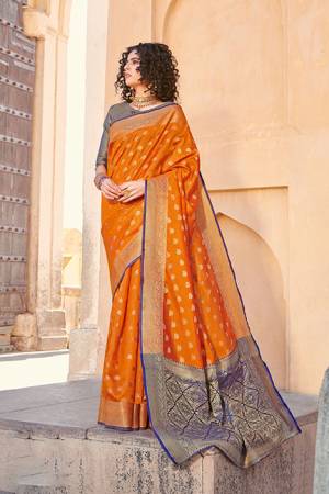 Classy Saree look pretty like never before.Wearing this Orange Color Saree which made from Handloom Silk With Blue & Golden Color Handloom Silk blouse, Saree has also decorative work like Heavy Jacquard Work With Pallu.This beautiful Saree features a classy Jacquard Work all over,which makes it a smart pick for all occasions. You can wear this Saree in different styles.