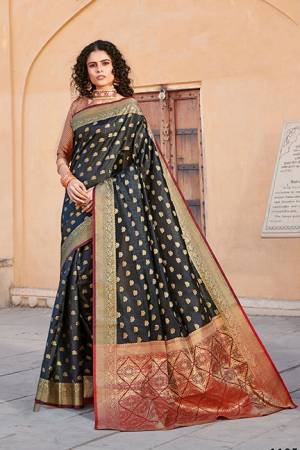 Classy Saree look pretty like never before.Wearing this Black Color Saree which made from Handloom Silk With Maroon & Golden Color Handloom Silk blouse, Saree has also decorative work like Heavy Jacquard Work With Pallu.This beautiful Saree features a classy Jacquard Work all over,which makes it a smart pick for all occasions. You can wear this Saree in different styles.