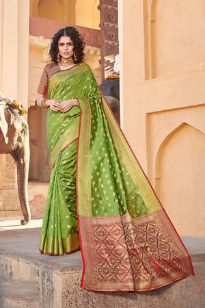 Classy Saree look pretty like never before.Wearing this Parrot Green Color Saree which made from Handloom Silk With Maroon & Golden Color Handloom Silk blouse, Saree has also decorative work like Heavy Jacquard Work With Pallu.This beautiful Saree features a classy Jacquard Work all over,which makes it a smart pick for all occasions. You can wear this Saree in different styles.